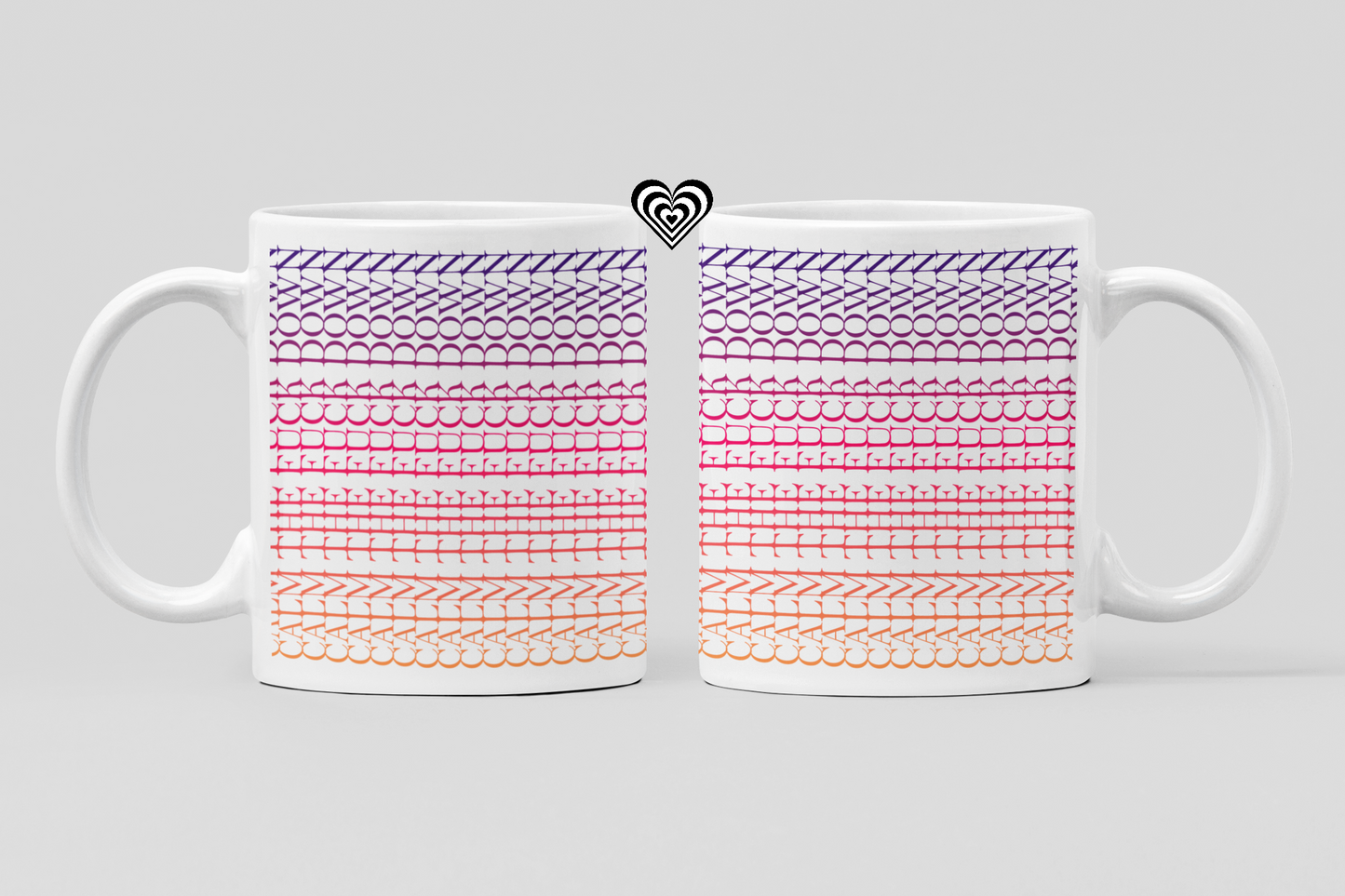 Two white mugs with colorful patterned designs on a light gray background