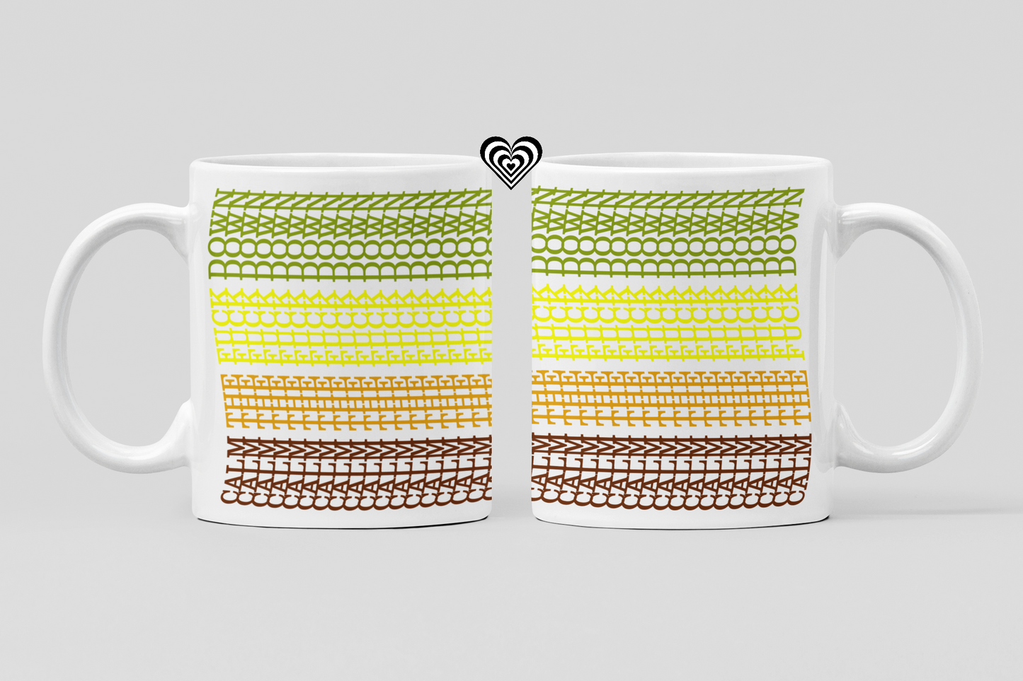 Two white mugs with a colorful pattern on a light gray background