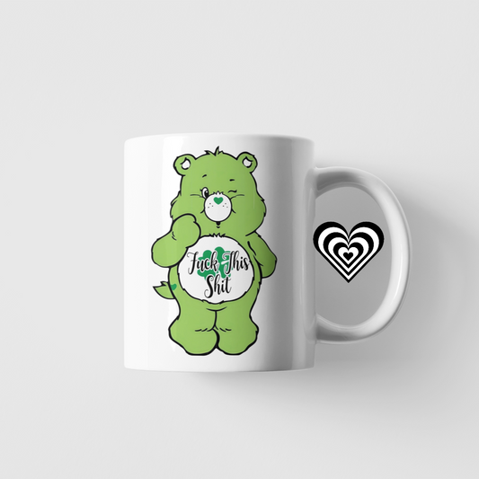 Mug with a green naughty bear design and 'fu*k this sh*t' text on a white background