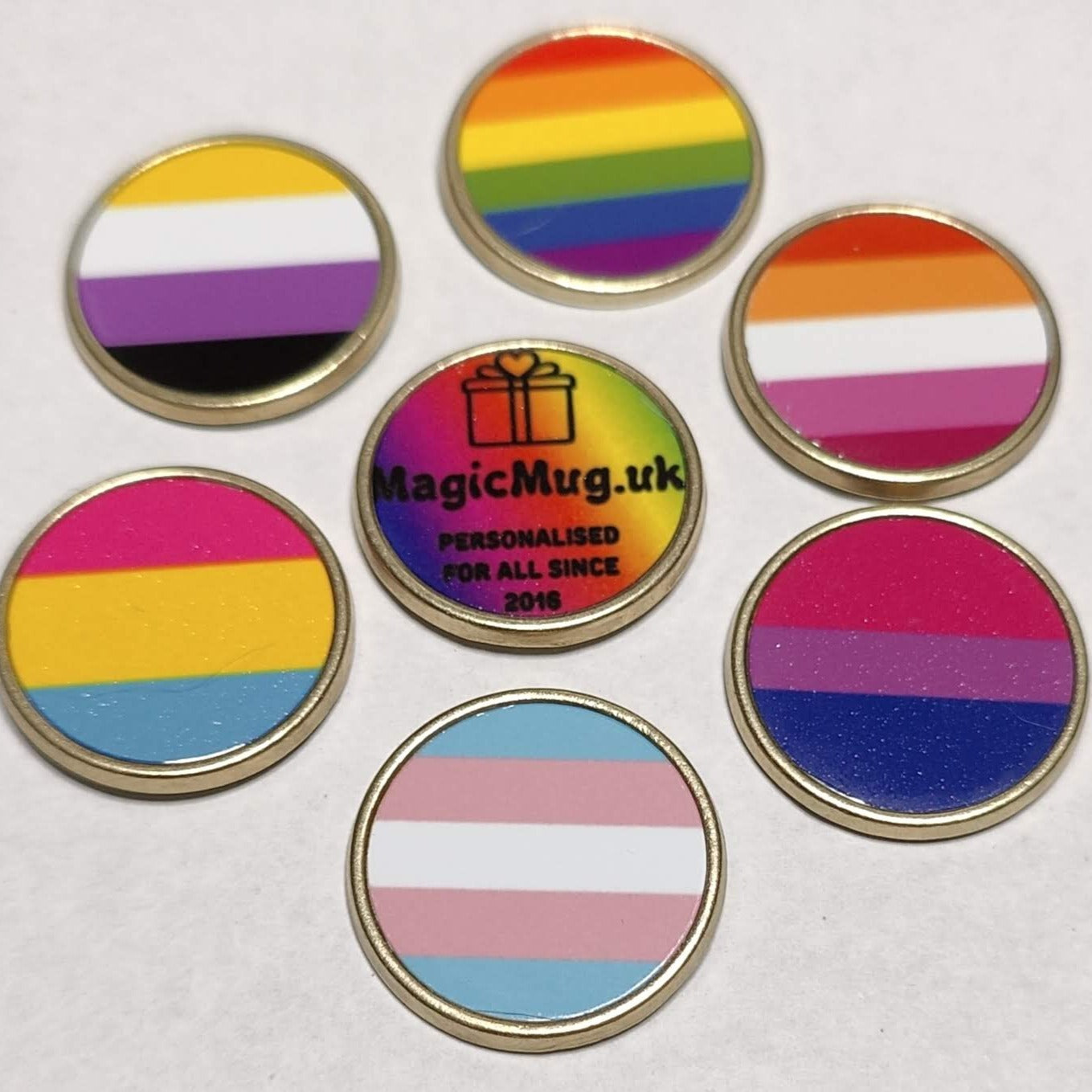 Gay Pride LGBTQ pins, on a plain white background