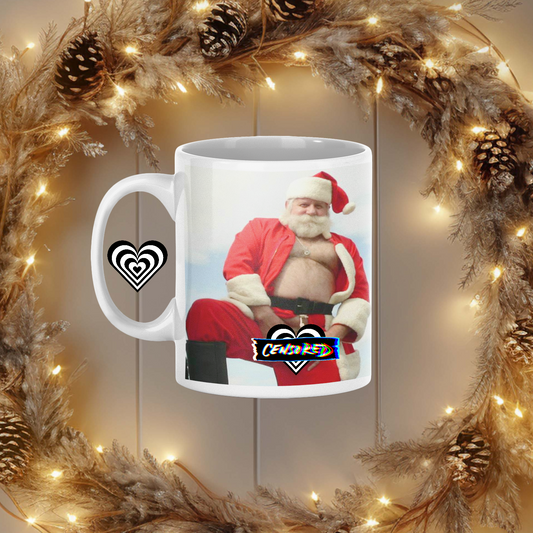 Mug with Naughty Santa Claus graphic on a decorative wreath with lights and pine cones Adult 
