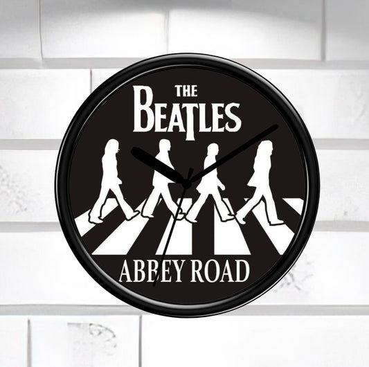 Wall clock with The Beatles Abbey Road design on a white background