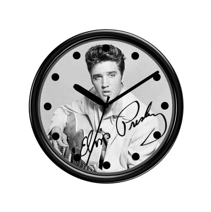 Black Wall clock with a black and white photo of Elvis The King of Rock and Roll and signature on a white background