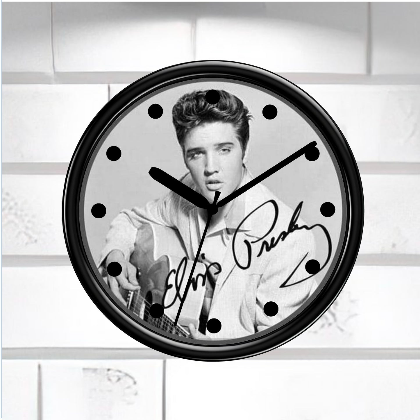 Wall clock with a black and white portrait of a famous person and signature on a light background