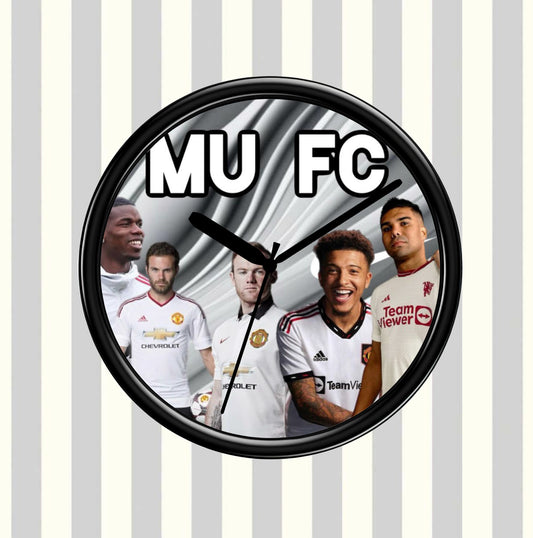 Wall clock with Manchester United FC logo and player images on a striped background