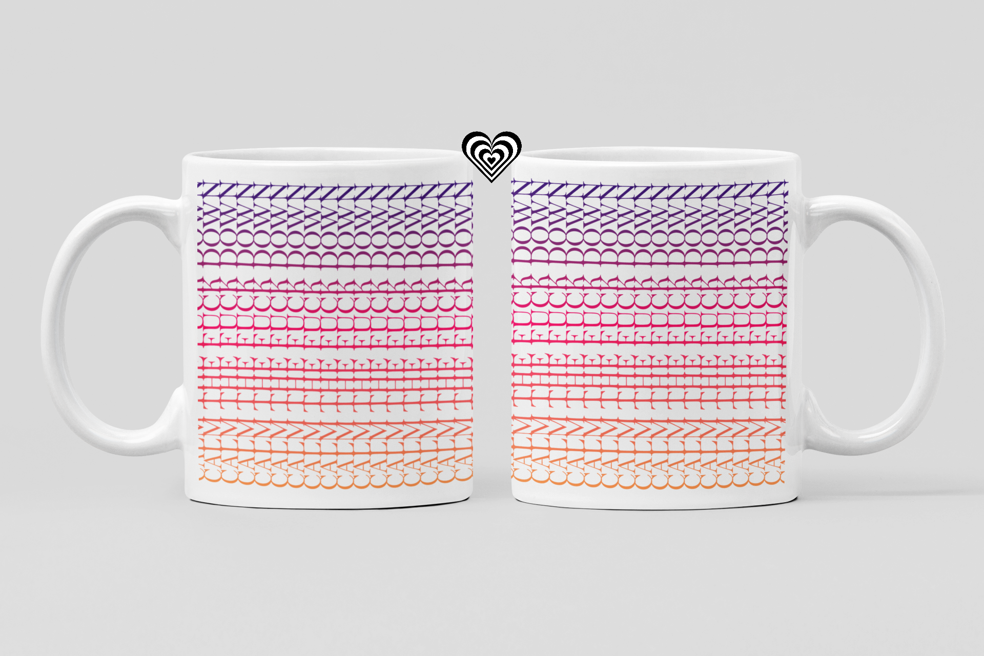 Two white mugs with colorful patterned designs on a light gray background