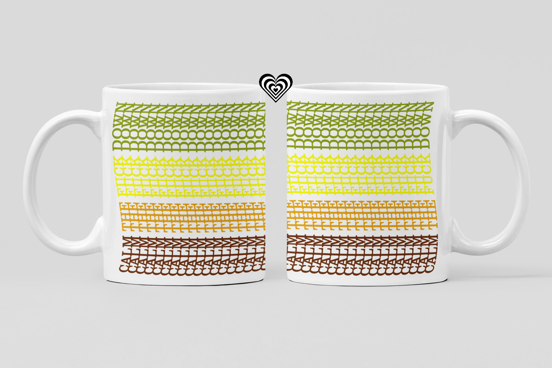 Two white mugs with a colorful pattern on a light gray background