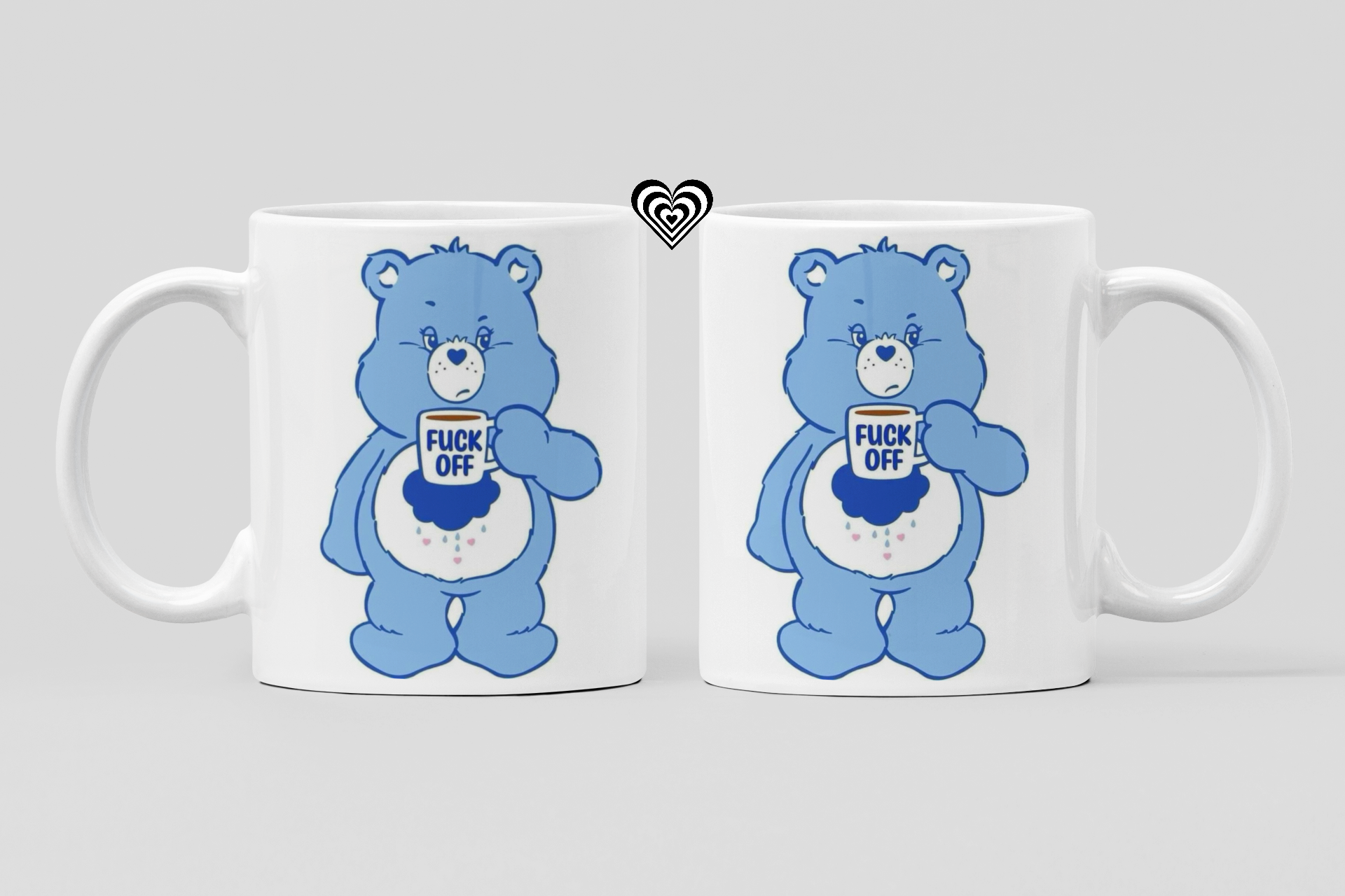 Two white mugs with blue cartoon bear designs and profane text on a light gray background.