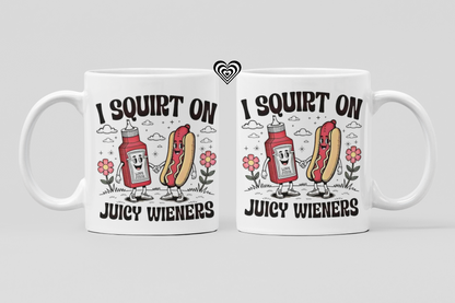 Two mugs with humorous designs of ketchup and hot dogs, text 'I Squirt On Juicy Wieners' on a light gray background.