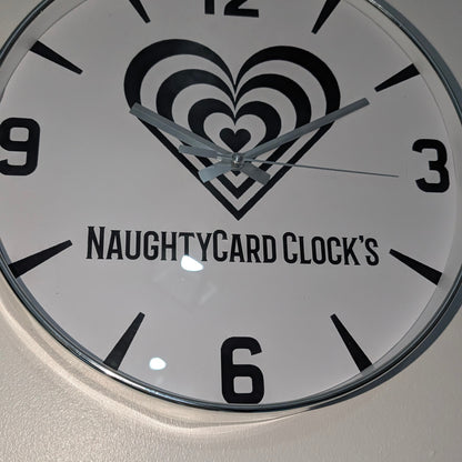 Silver Clock with heart design and 'NAUGHTYCARD CLOCK'S' text on a white background
