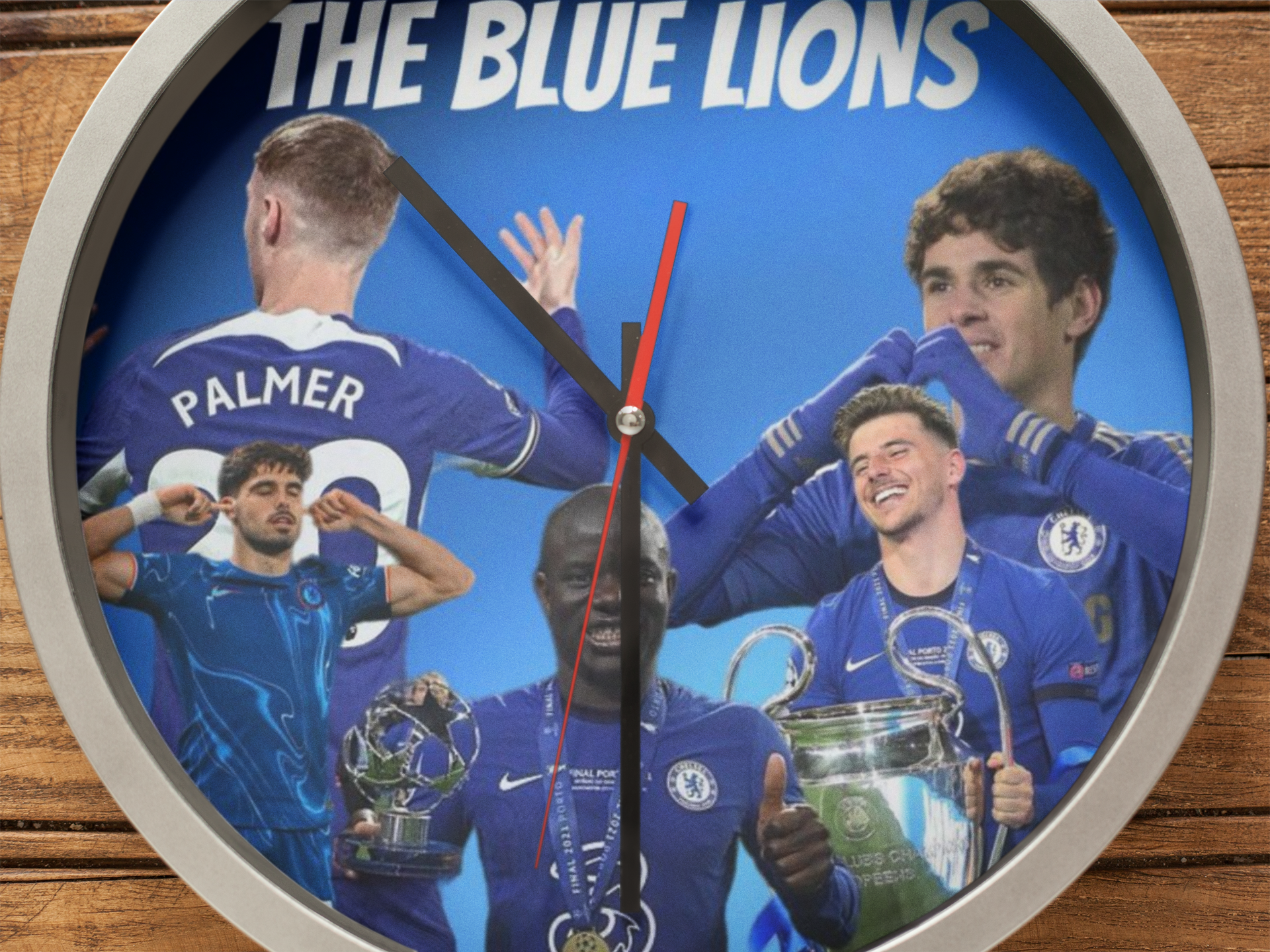 Wall clock with images of soccer players and 'The Blue Lions' text on a blue background